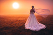 Bride in beautiful morning nature, colorful wedding photo