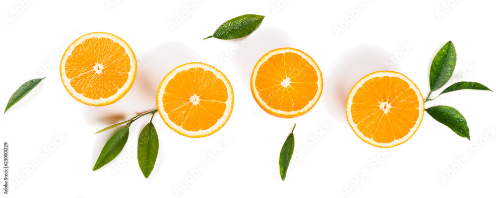  Half cut oranges and green leaves. - obrazy, fototapety, plakaty 
