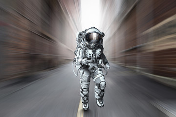Wall Mural - Spaceman running fast. Mixed media