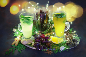 Christmas holiday hot drinks - concept of festive bar menu. Lemon, grape and ginger tea.