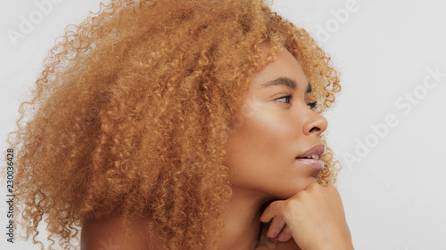 Mixed Race Black Blonde Model With Curly Hair In Profile Turned To