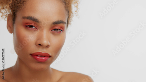 Mixed Race Black Blonde Model With Curly Hair With Red Makeup Calm