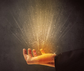 Poster - Yellow ray of light coming from a young hand 