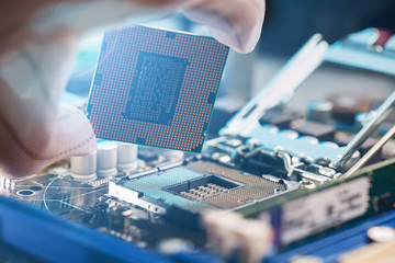 Electronic engineer of computer technology. Maintenance computer cpu hardware upgrade of motherboard component. Pc repair, technician and industry support.