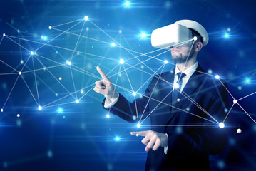 businessman in virtual reality goggles investigate global network connectivity concept