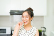 © makistock - Asian woman preparing healthy meal in her home kitchen