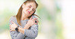 © Krakenimages.com - Middle age mature beautiful woman wearing stripes winter sweater over isolated background Hugging oneself happy and positive, smiling confident. Self love and self care