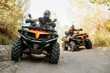 Two Quad Bike Riders Travels In Forest, Front View