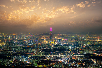 Fototapete - Sunset scene over Seoul city view from Namhansanseong fortress. The best view of skyscrapers lit up with the han river in the background at Seoul city, South Korea