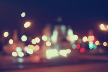 blurred bokeh city background / glare and glowing light in night city, modern beautiful bright backg