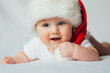 © kaloriya - Cute little baby in santa hat on white background