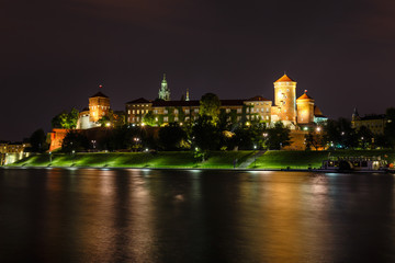 Wall Mural - Wawel Castle in the evening in Krakow with reflection in the river, Poland. Long time exposure