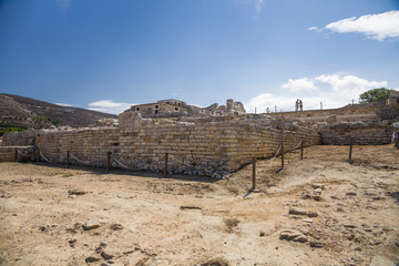 Red columns of the Knossos palace. Fragment of the ruins of the Knossos palace. Architecture on Crete, Greece.