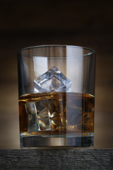 Wall Mural - Glass with whiskey and ice cubes