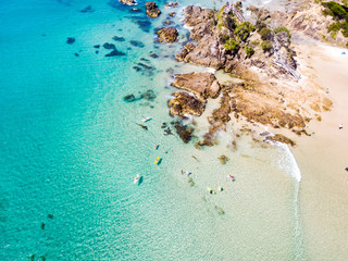 Canvas Print - The Pass and Wategoes at Byron Bay from an aerial view with blue water