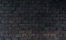 Black And Brown Brick Wall Rough Texture Background With Space For Text. Background For Death, Sad, Hopeless And Despair Concept. Dark Brick Wall For Grieving Emotional. Exterior Architecture.