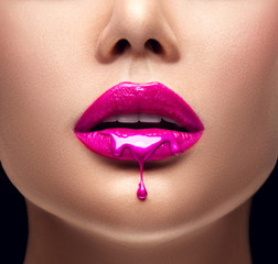 Poster - Pink lipstick dripping. Lipgloss dripping from sexy lips, Purple liquid drops on beautiful model girl's mouth, creative abstract makeup