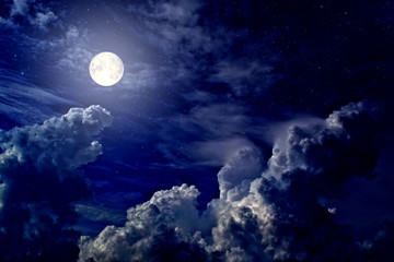 Wall Mural - Full moon and stars in cumulus clouds