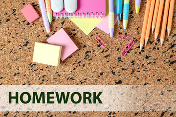 Canvas Print - Flat lay composition with school supplies and word HOMEWORK on corkboard background