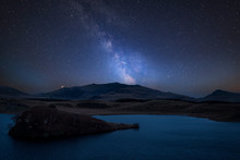 Vibrant Milky Way Composite Image Over Landscape Of Llyn Y Dywarchen Lake In Snowdonia National Park