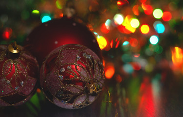 Wall Mural - christmas ball close-up on the background of the lights garland blurred purple and blue background