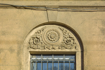 Poster - window with stucco molding with flower ornament above