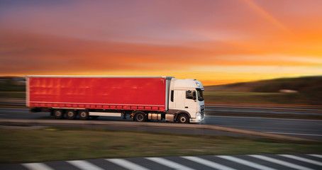 Truck with container on road, cargo transportation concept.