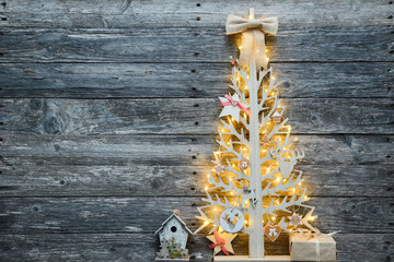 Wall Mural - christmas wooden tree natural decoration ornament and copyspace on old wood board