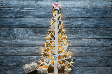 Wall Mural - christmas wooden tree natural decoration ornament and copyspace on old wood board