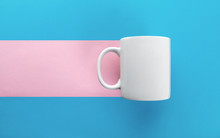 White Mug On Blue And Pink Background