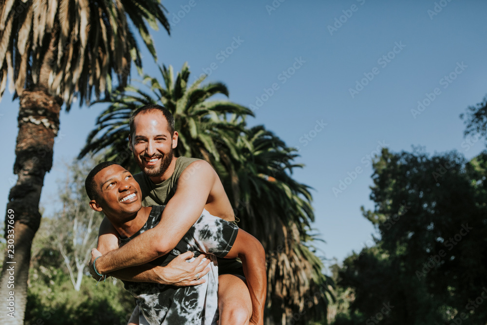 Gay couple hugging in the park
