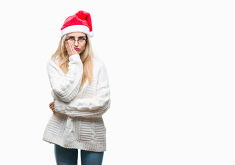 Poster - Young beautiful blonde woman wearing christmas hat over isolated background thinking looking tired and bored with depression problems with crossed arms.