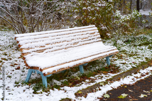 Autumn Scenery Old Garden Bench In Late Fall Covered By First