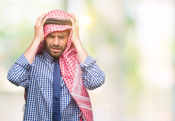 Sticker - Young handsome arabian business man wearing keffiyeh over isolated background suffering from headache desperate and stressed because pain and migraine. Hands on head.