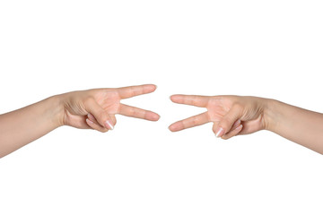 hands of two people gaming in the scissors-paper-stone with sign of scissors