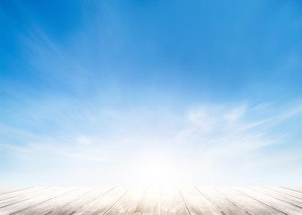 Wall Mural - White wood floor with cloud sky blurred during morning open view out windows beautiful summer spring and peaceful nature background.