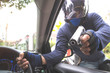 © feeling lucky - thief with gun on motorcycle trying to steal car or money (theft concept)