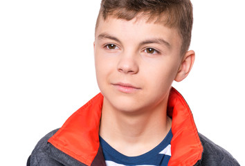 Wall Mural - Close up emotional portrait of caucasian smiling teen boy. Head shot of handsome guy. Funny cute teenager, isolated on white background. Child looking away.