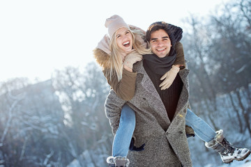 Two young people enjoying in the snow