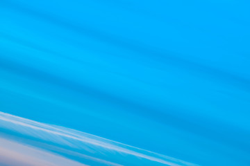 Wall Mural - varicolored striped surreal sky with shades of blue, cyan, cobalt, pink colors. diagonal lines of sm