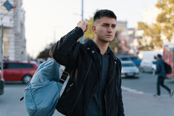 A man traveler with his backpack exploring city