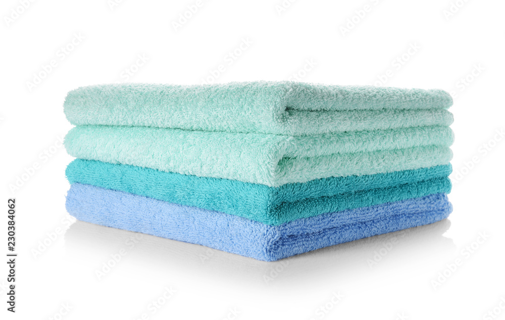 Stack of clean soft towels on white background