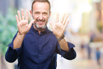 Middle age hoary senior man over isolated background showing and pointing up with fingers number ten while smiling confident and happy.