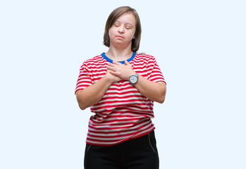 Sticker - Young adult woman with down syndrome over isolated background smiling with hands on chest with closed eyes and grateful gesture on face. Health concept.