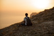 © Анна Дианова - man sitting on a rock