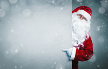 Santa Claus Pointing On Blank Advertisement Banner With Copy Space