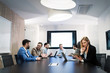 © NDABCREATIVITY - Picture of businesspeople having meeting in conference room