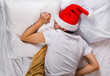 © Sabphoto - Young Man sleep in Santa Hat