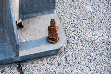 Rusted And Damaged Bolt And Nut In The Post Mount