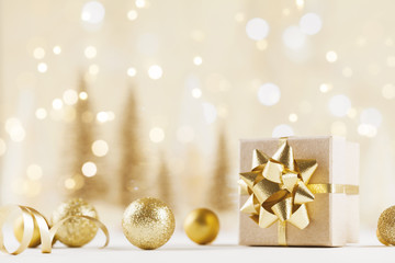 Christmas gift box against golden bokeh background. Holiday greeting card.